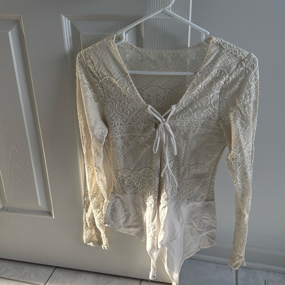 Charlotte Russe cream colored size large lace body suit